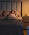 Child sleeping peacefully in bed with soft lighting, featuring Top Shelf Dimmer Light Switch 6 Pack White single pole setup.