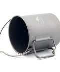 Ultralight Titanium 750ml Pot With Bail Handle for Camping shown on its side, open flame ready and lightweight.