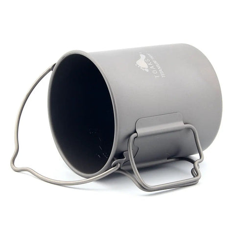 Ultralight Titanium 750ml Pot With Bail Handle for Camping shown on its side, open flame ready and lightweight.