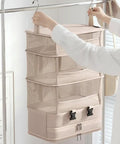 Heavy Duty Hanging Travel Shelf Bag Organizer For Luggage Suitcase With Ventilated Mesh Pockets And Water Repellent Nylon Fabric showing compact design.