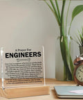 Clear Desk Sign For Engineers Gift Idea Nerdy Graduation Gift For Civil Mechanical Electrical Engineers On A Wood Stand Acrylic Home Office Desk Decor displayed on a desk.