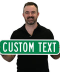 Custom Green Street Signs Personalized Aluminum Yard Decor Rock Solid Heavy Duty Outdoor Message Plate 6 By 24 Inches held by a man.