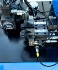 Hydraulic components of Tough As Nails Hydraulic Cold Cut Saw, showcasing pump and valves for efficient operation.