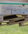 Light Duty Clamp On Pallet Forks, 43 Inch Overall Length under wooden pallet, showcasing 30 Inch By 3 Inch Fork Blades in use