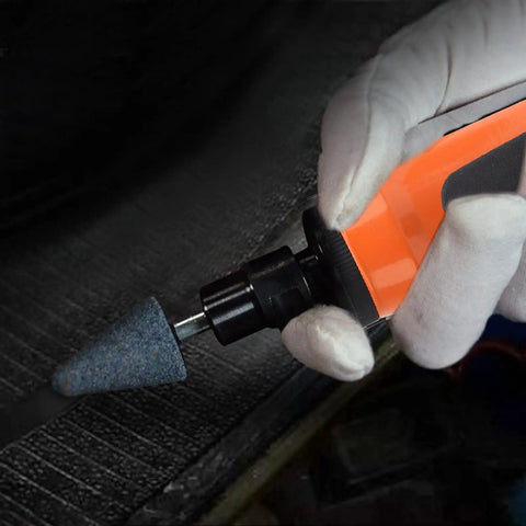 Hand holding Straight Pneumatic Air Die Grinder Kit With Quarter Inch Collet Japanese Style Ergonomic Grip with abrasive stone bit.