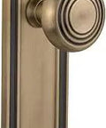 Mission Plate With Deco Knob Passage Door Hardware In Antique Brass, Old School Style With Solid Forged Brass Plates And Genuine Lead Crystal Knobs, Non Locking Complete Two Sided Set For One Door Two And Three Quarters Inch Backset Retrofit Ready in vertical view.