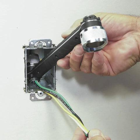 Conduit Locknut Wrench For One Half Inch And Three Quarter Inch Connectors With Direct Drive Heads in use on tight electrical box