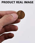 Slick Brown Screw Hole Cover Stickers 108 Piece Self Adhesive Round Caps, 21mm PVC cap held in hand, smooth finish.