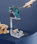 Person using Beefy Sturdy Drill Press Adapter Stand For Floor Or Table Use Universal Bench Clamp For Drill Workbench And Repairs Aluminum Base