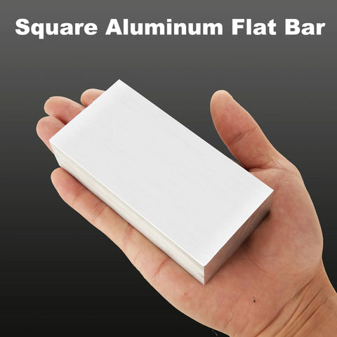 Square aluminum flat bar held in hand; silver, 4 x 2 x 1 in