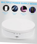 White Electric Rotating Display Stand For Jewelry Watches And Cosmetics Automatic Turntable Showcase with power supply options and controls.
