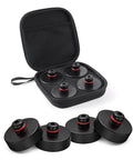 Open black storage case showing four round black rubber Tesla floor jack pads with red rings.