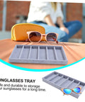 Keep Your Shades Locked And Loaded In This Slick Six Slot Sunglasses Tray And Jewelry Display Holder Crafted From Premium Soft Fabric For Zero Stress Eyewear Organization on a wooden surface with sunglasses and case