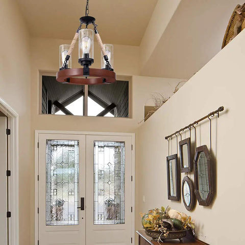 Farmhouse Wagon Wheel Ceiling Chandelier With Wood Frame And Seeded Glass Shades installed in a foyer with decorative mirrors.