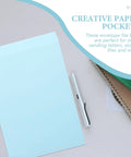 Self Adhesive Light Blue Envelopes 15 Pack For Letter Sized Documents Thickened Paper Pockets Easy To Use For Office Filing Bags And Privacy Protecting Document Storage, shown with pen and notebooks