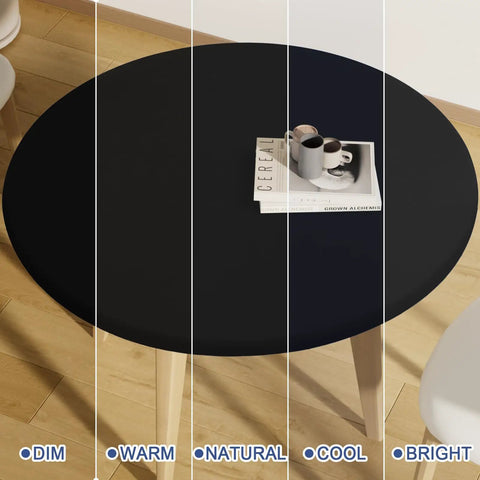 Round Spandex Tablecloth With Elastic Edge No Slip Waterproof Stretch Fit For 45 To 56 Inch Tables Ideal For Indoor Outdoor Dining And Camping Picnics Easy Care Washable Black shown on a wooden table with cups and a book.
