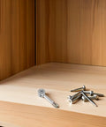 40 Pcs Cam Lock Furniture Fasteners Dowel Pins Kit For Wardrobe Panels And DIY Furniture on wooden surface