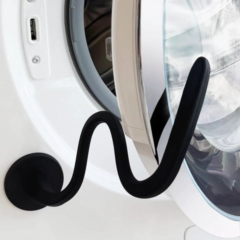 Magnetic Front Load Washer Door Prop and Holder with Strong Magnet and Flexible Hose installed on a washer, sleek black design.