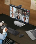 Person using Top Shelf Pro Level 4K Ultra Hd Webcam Featuring Sony Starvis Sensor for Microsoft Teams calls on a computer.