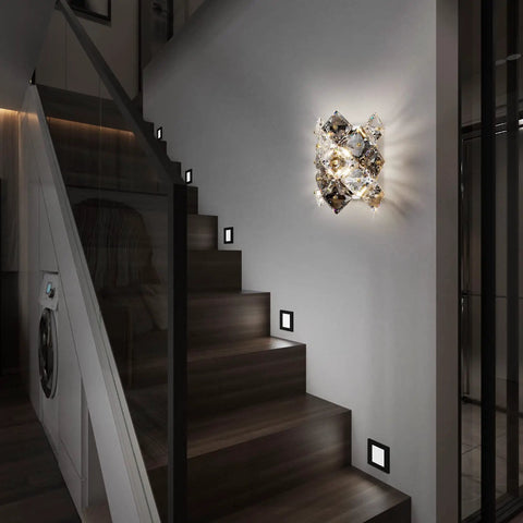Modern Crystal Wall Sconces With Chrome Finish illuminating a staircase wall, showcasing luxury indoor lighting design