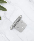 Set Of Four Spring Loaded Cabinet Hinges Self Closing Heavy Duty Iron Hardware For Kitchen Cabinets And Furniture on marble surface