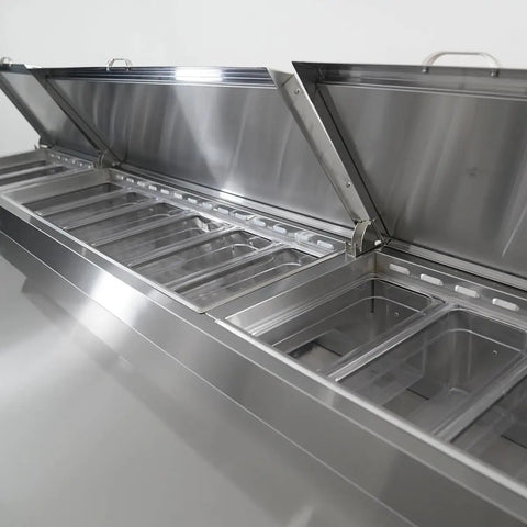 No Nonsense Heavy Duty Commercial Prep Table Refrigerator With Extra Wide Stainless Steel Worktop And Massive Cold Storage For Pizza And Sandwich Professionals, open stainless steel lids revealing storage bins.