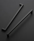 Two matte black 18 Pack 12.6 Inch Square Kitchen Cabinet Handles Matte Black Drawer Pulls For Cupboards And Drawers on black surface