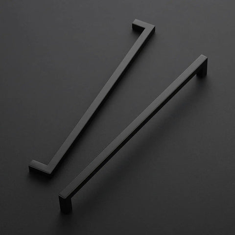 Two matte black 18 Pack 12.6 Inch Square Kitchen Cabinet Handles Matte Black Drawer Pulls For Cupboards And Drawers on black surface
