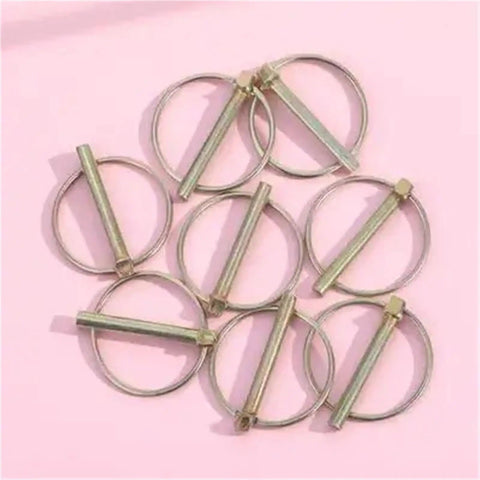 Lynch Pin 16 Piece Assortment Kit For Farm Tractors Trailers Mowers And Trucks Self Locking Spring Ring Design shown on pink surface
