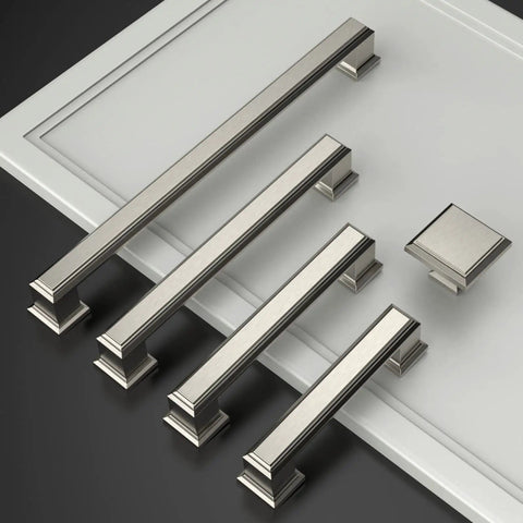 Set Of Five Premium Brushed Satin Nickel Kitchen Cabinet Knobs For Drawers And Pantries top view on a white surface.