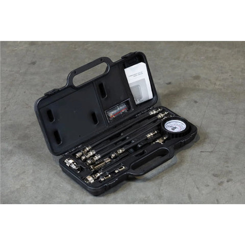 Mityvac MV5530 engine compression test kit, top view in black case with 2-3/4 in Bourdon gauge and adapters.