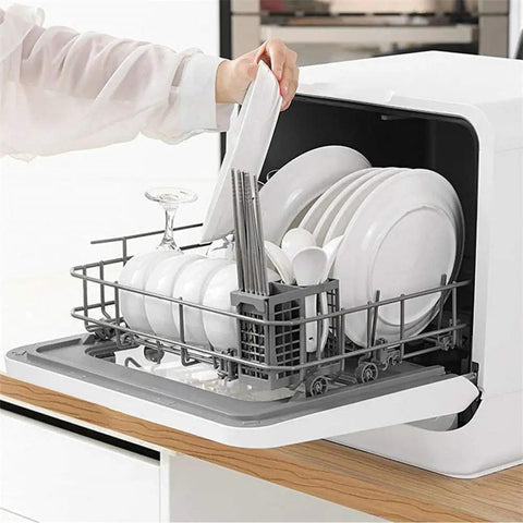 Compact Countertop Dishwasher With Six Place Settings And Five Wash Cycles Makes Kitchen Cleanups A Total Breeze For Small Apartments And Busy Homes, holding plates and utensils.