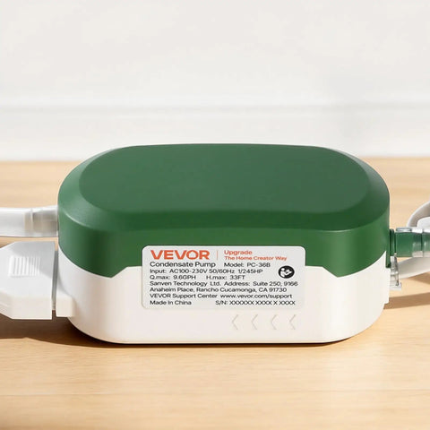Condensate Pump With Automatic Safety Switch For Air Conditioners Dehumidifiers HVAC Furnaces And Ice Makers Delivers Nine Point Six GPH Up To 33 Feet Lift 100 To 230 Volt Ultra Quiet 21 DB No Fuss Drainage For Long Distance And Uphill Runs. compact green and white pump with side tubing