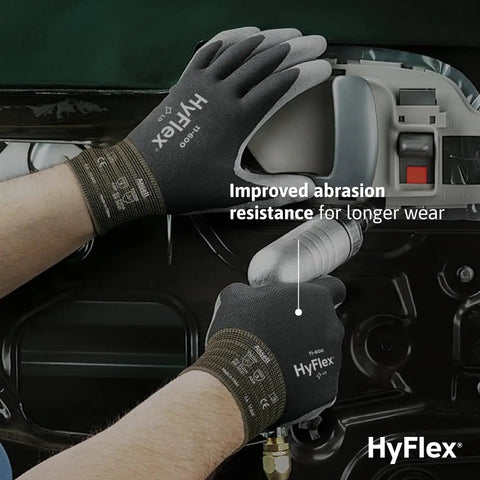 Multi Purpose Light Duty Work Gloves With Palm Coating For Metal Fabrication Automotive And Machinery Use Polyurethane Dipped Palms For Abrasion Resistant Grip Size 10 Black 12 Pairs; person using gloves on metal fabrication task