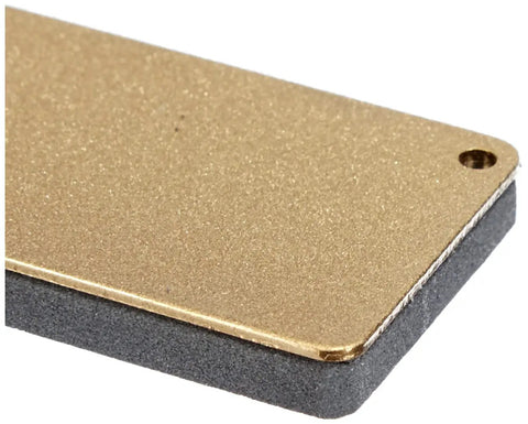 Close-up of DC4 Diamond Ceramic Whetstone Sharpener for Knives, pocket sized, with gold and gray finish, wet or dry use.