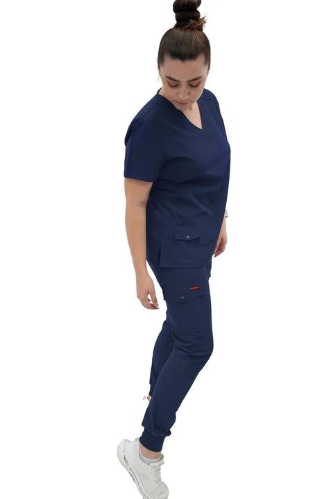 Women's Slim Fit Jogger Scrub Pants With Elastic Yoga Waistband Nurse Medical Uniform, navy color, worn by model, side view.