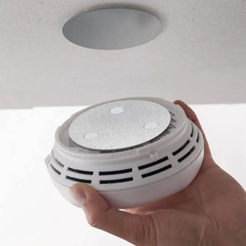 Installing smoke alarm with No Drilling Magnetic Smoke Alarm Mounts 3 Pack With Adhesive Pads for quick mess free ceiling install.