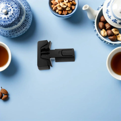Kid Safe Refrigerator Locks 4 Pack No Tool Needed Quick Install Black ABS Material on a blue surface with tea set and nuts.