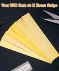 Brass Shim Stock Assortment Set For DIY Pros, 16 brass strips in varying thicknesses, shown with scissors and measuring tool
