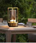 Portable Metal Table Lamp Cordless Rechargeable LED Light With 3 Color Infinitely Dimming Battery Powered Small Desk Lamp in Sleek Gold on patio table