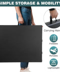 Person holding Six Foot Outdoor Folding Dining Table For Parties And Weddings, Portable Rectangular Plastic Table With Built In Carrying Handle, Black