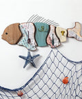 Colorful wooden fish wall decor with starfish and net, perfect for coastal themed rooms, showcasing creative design.