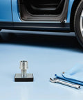 Heavy Duty Rubber Lift Tray Pad With Enhanced Load Distribution And Wear Resistance For Car Shops Off Road Gear And Heavy Maintenance Tasks, shown beside a wrench and cloth.