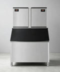 Heavy Duty Commercial Ice Maker Pumping Out Crisp Clear Cubes On The Fly With Stainless Steel Frame And Roomy Storage Bin.