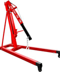 Heavy Duty 2 Ton Folding Hydraulic Engine Hoist Handling Up To 4000 Pounds Without Breaking A Sweat For Home Garages And Pro Auto Shops with a sturdy red frame and caster wheels.