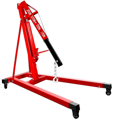 Heavy Duty 2 Ton Folding Hydraulic Engine Hoist Handling Up To 4000 Pounds Without Breaking A Sweat For Home Garages And Pro Auto Shops with a sturdy red frame and caster wheels.