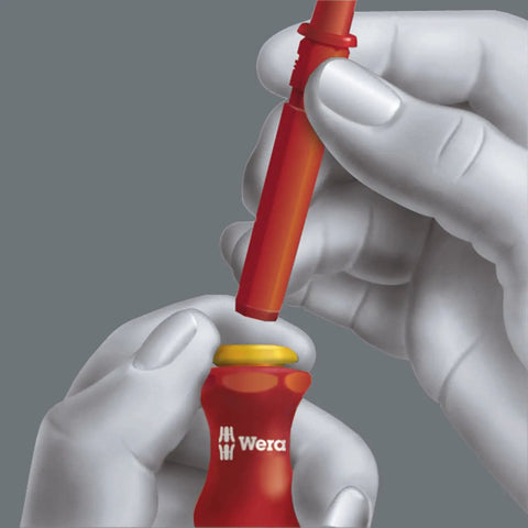 Hands attaching blade to Insulated Kraftform Kompakt VDE Blade Set With 60i 62i 65i 18, showing pro grade anti roll handle.