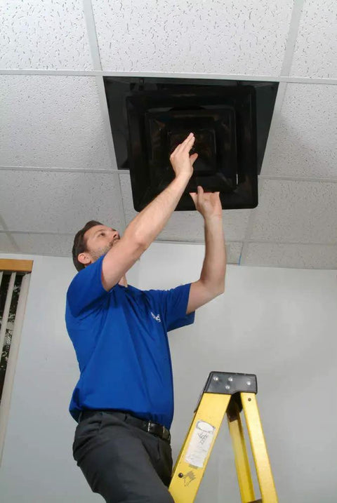 Person installing Lay In 2x2 Ceiling Diffuser With 3 Cone Supply And 8 Inch Pre Molded Boot In ABS Plastic Black