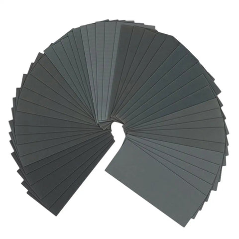 Five Pack Premium Waterproof Sandpaper Sheets For Wet And Dry Use arranged in a circular pattern, showcasing various dark colors.
