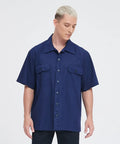Men's Short Sleeve Work Shirt In Navy Blue Cotton Poly Blend Durable Button Front Uniform Features Double Chest Pockets Built Hella Tough For The Daily Grind And Extra Large Cut, displayed on a male model.